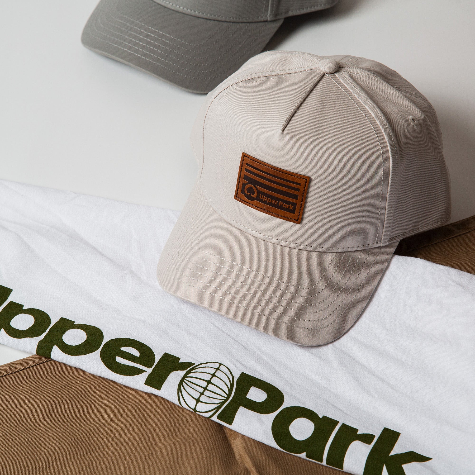 Upper Park high profile hats sitting on some stairs