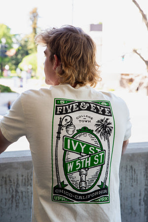 man wearing a 5th and Ivy shirt from Upper Park Clothing in a park garage faced outwards towards California State University, Chico