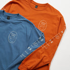 Bay Waves Standard Long Sleeve Shirt - Upper Park Clothing - Orange and blue long-sleeve shirts with 'Upper Park' logo on a white background