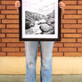 women standing in front of a brick wall in Downtown Chico holding a Bear Hole Poster in a Frame from Upper Park Clothing