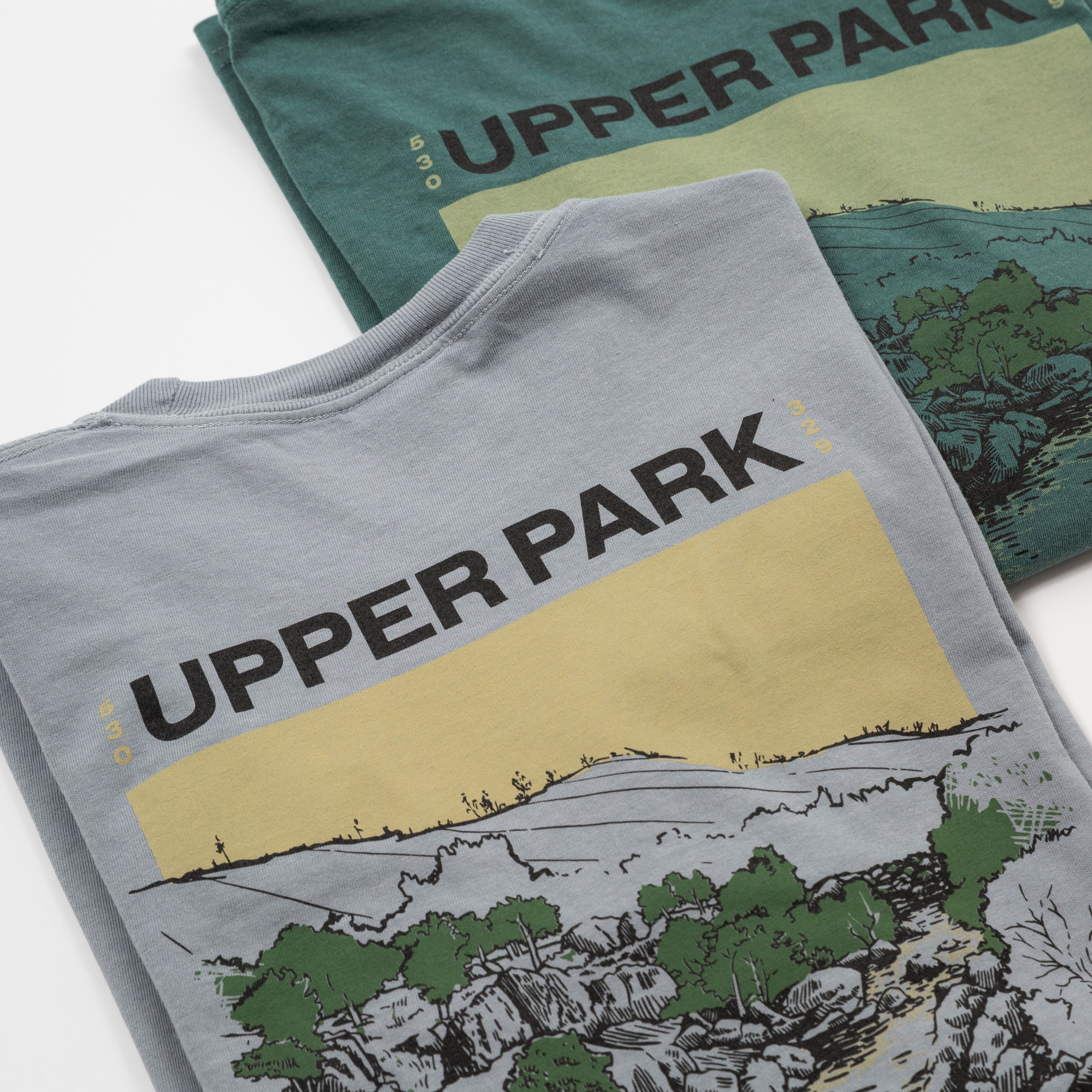 Gray sweatshirt with 'Upper Park' design on a white background