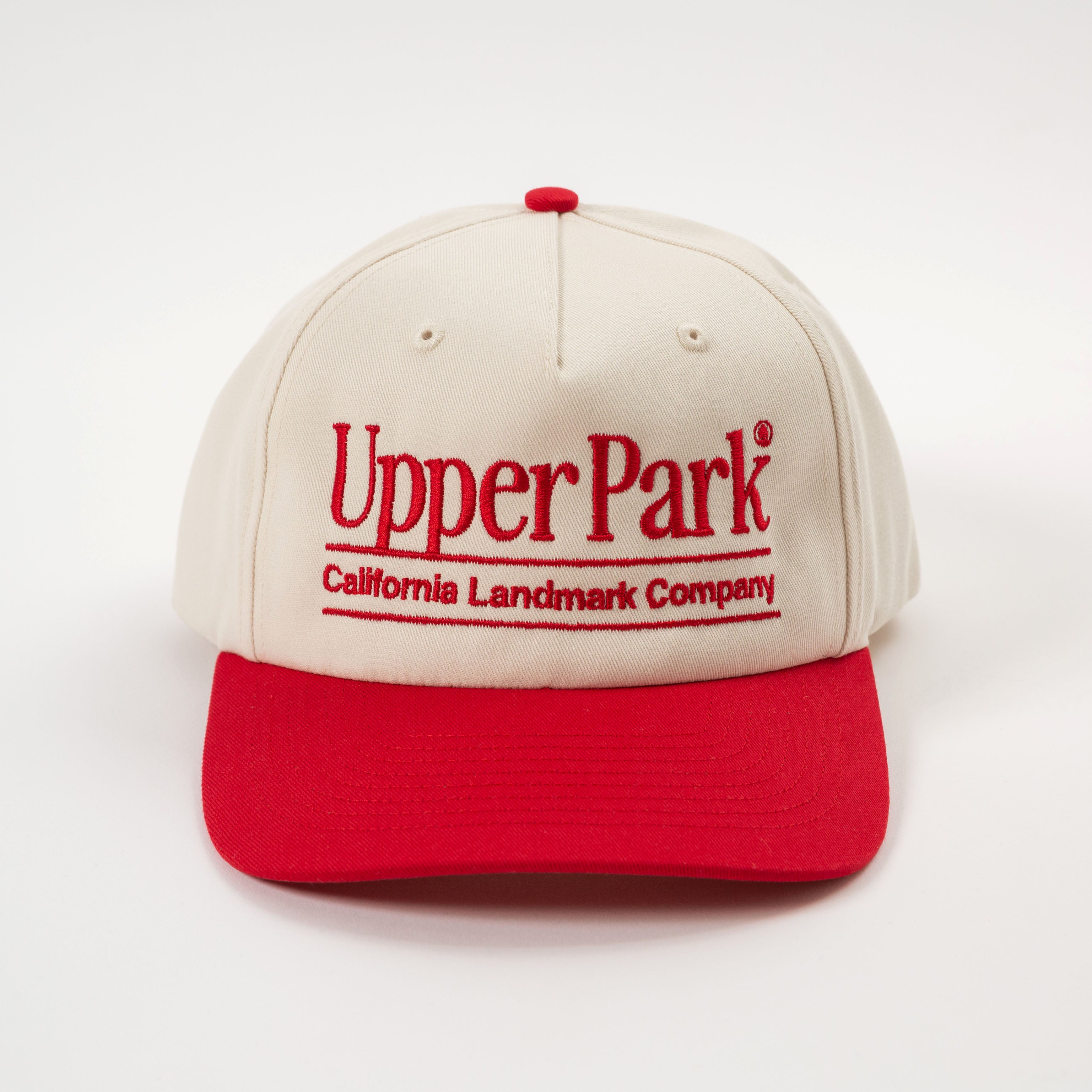 Cream and red cap with 'Upper Park' branding on a white background - California Landmark Company