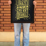 women standing in front of a brick wall in Downtown Chico holding a Chico Streets Poster in a Frame from Upper Park Clothing
