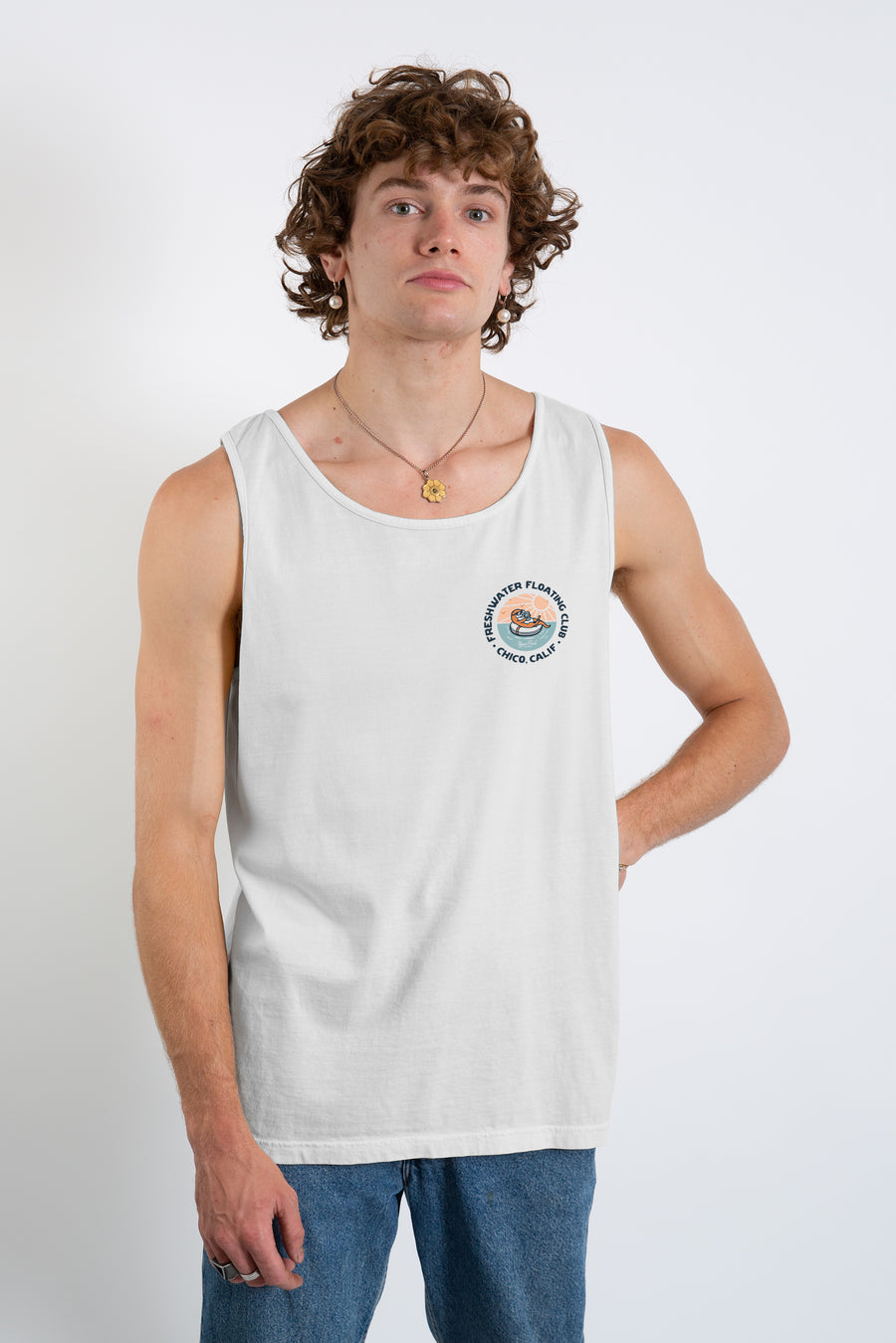 man standing in a photography studio wearing a Freshwater Floating Club washed tank top from Upper Park Clothing