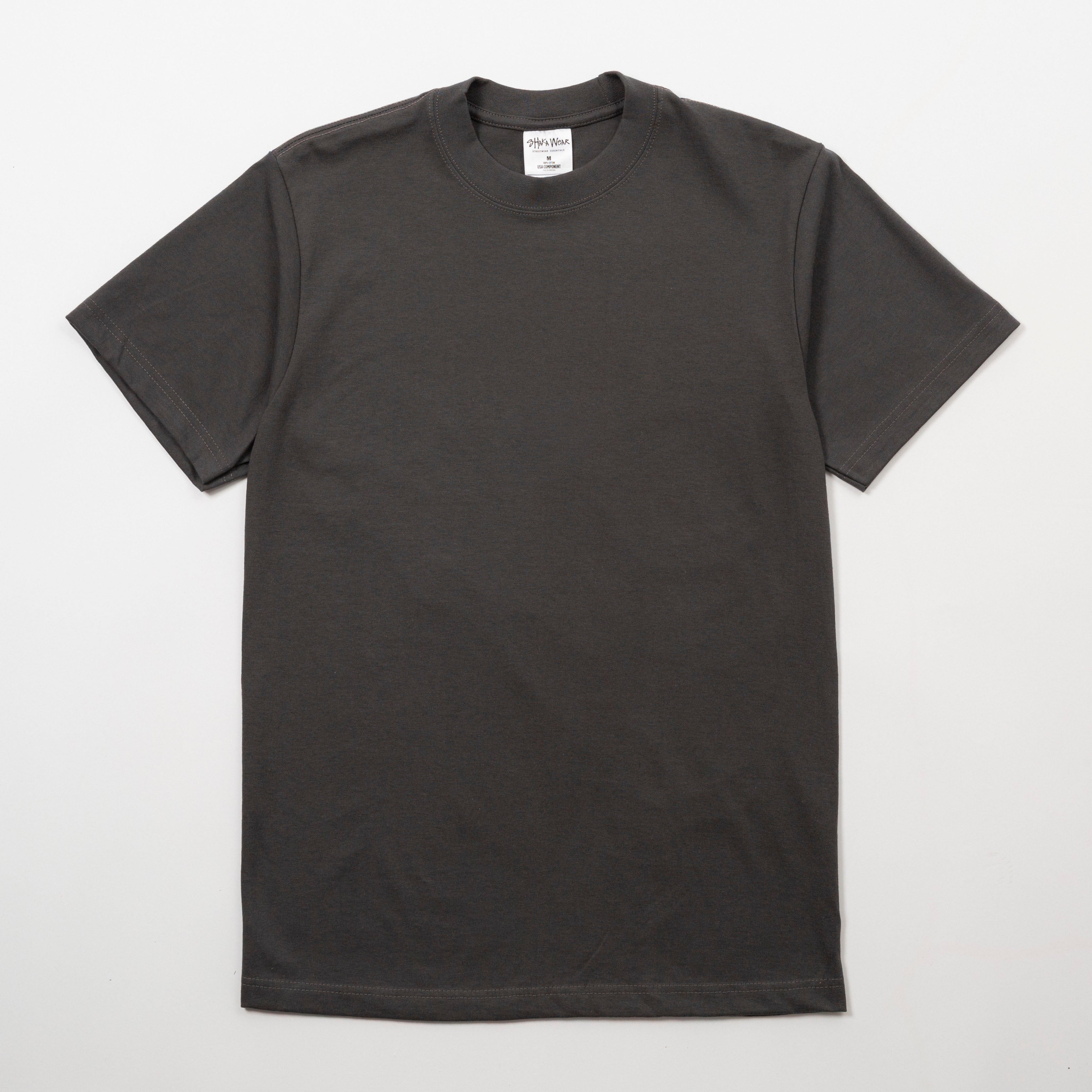 Plain black t-shirt on a light gray background - Shaka Wear 7.5oz Heavyweight Cotton Tee