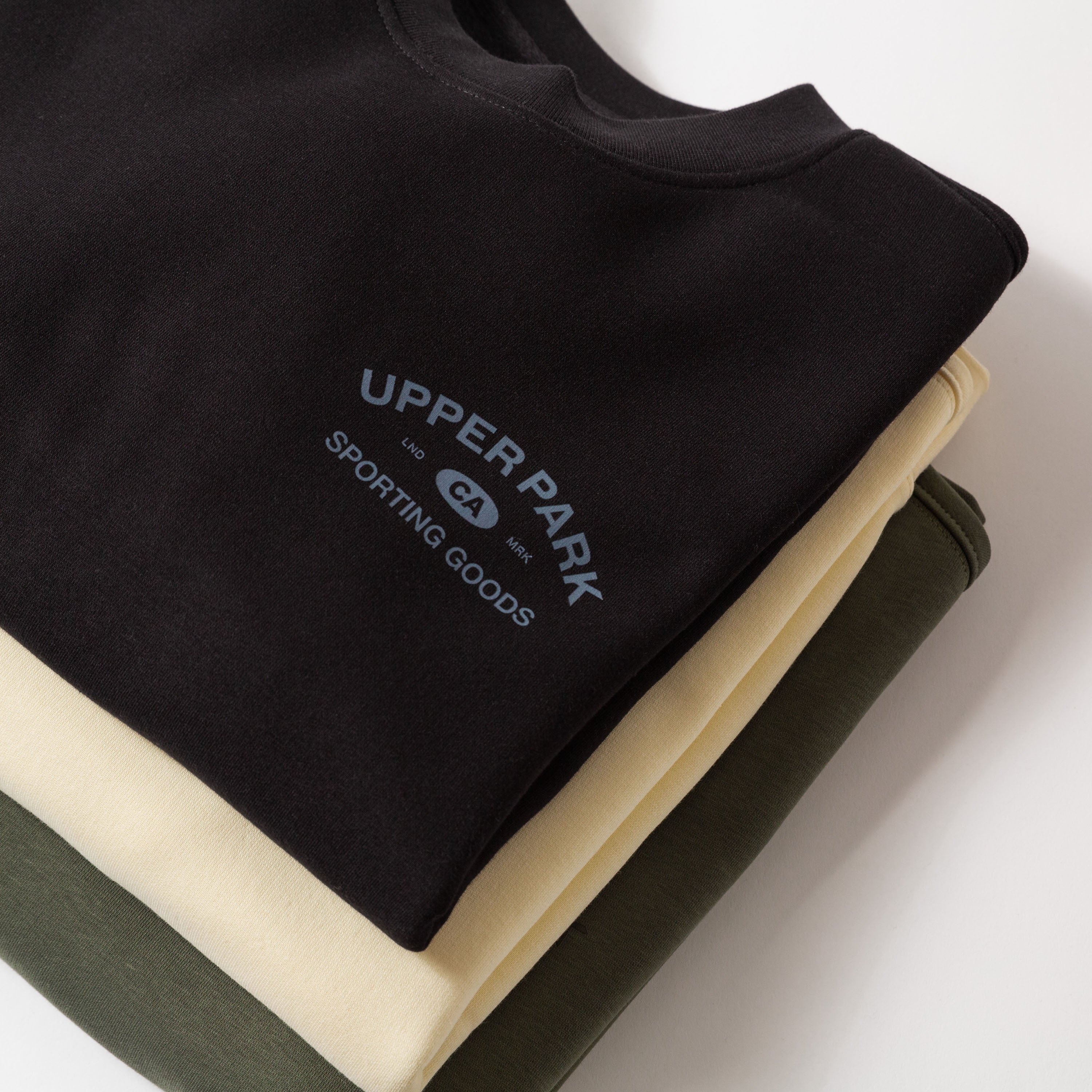 Black sleeveless shirt with 'Upper Park Sporting Goods' logo on a white background - Upper Park Athletics Sweater Set