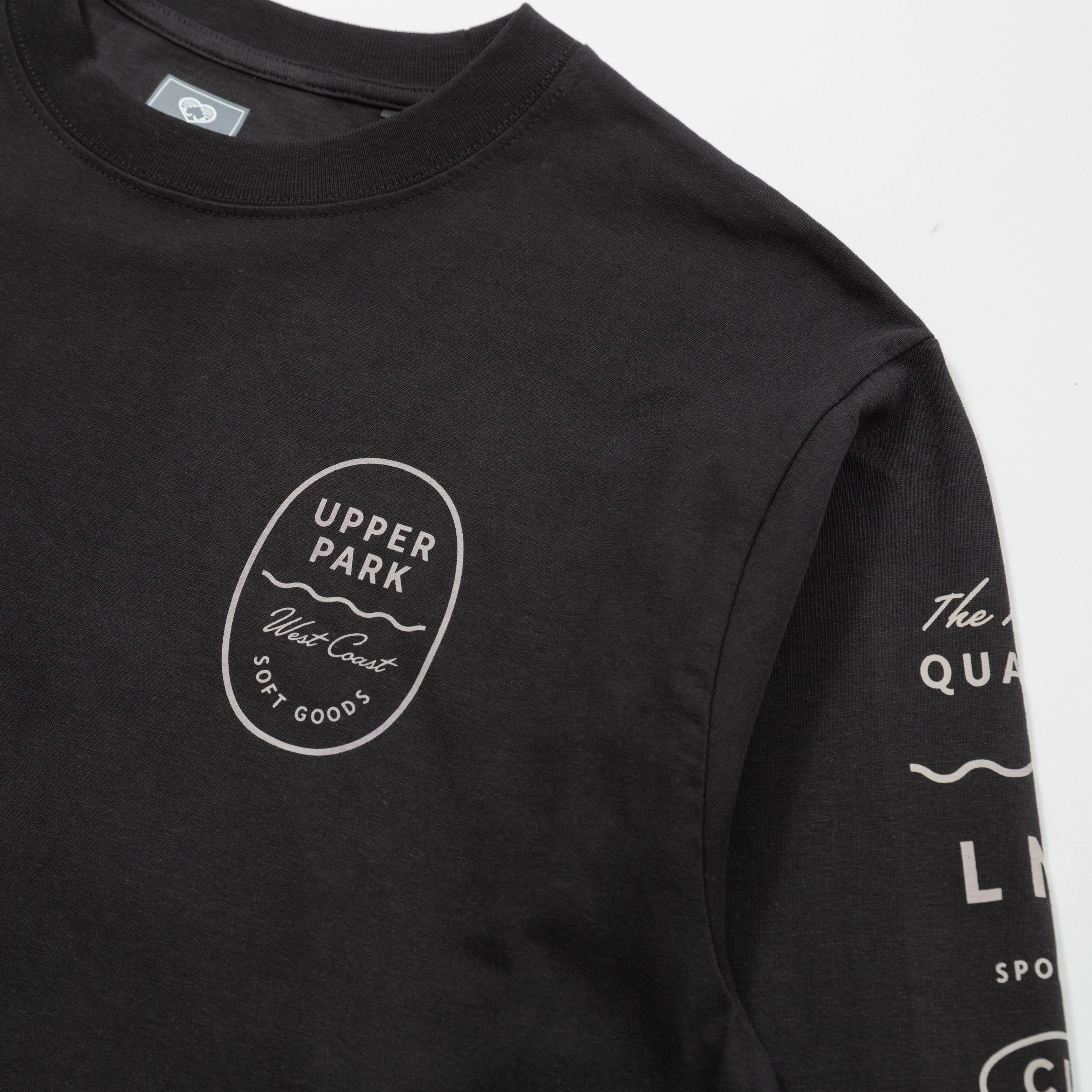 Upper Park Bay Waves Organic Cotton Long Sleeve shirt - Black long-sleeve shirt with white branding and text on a light gray background
