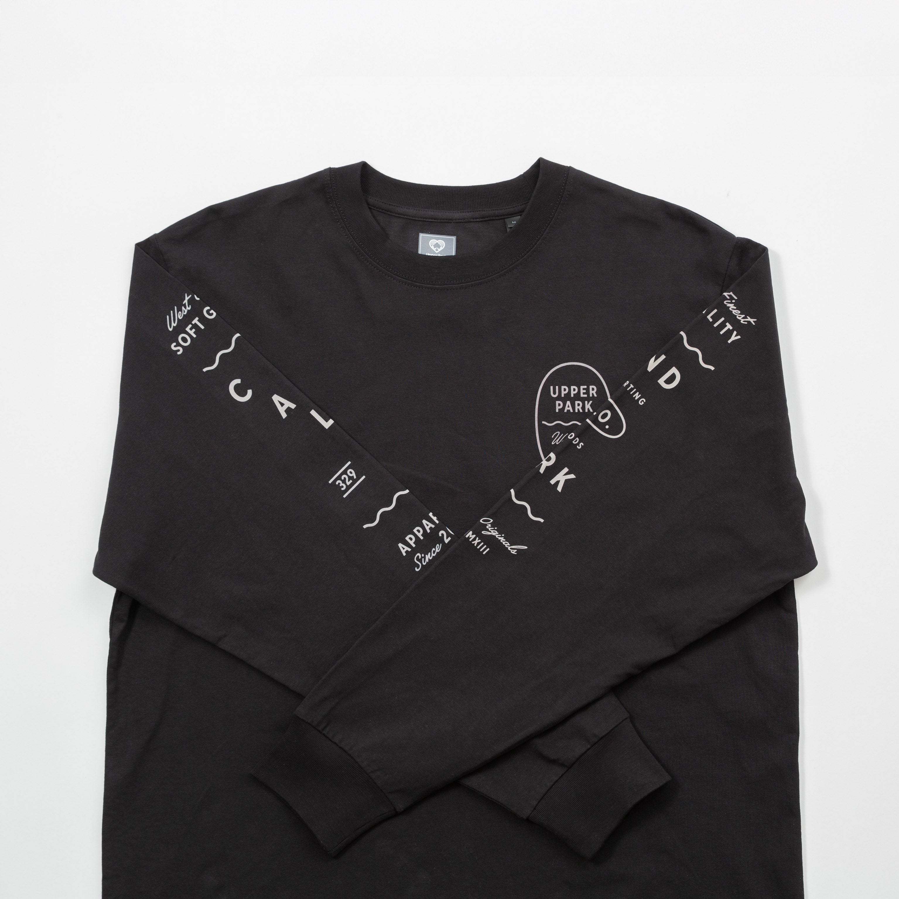 Upper Park Bay Waves Organic Cotton Long Sleeve shirt - Black long-sleeve shirt with white text and graphics on a light gray background