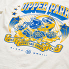 Upper Park Golden Varsity Shirt - Oversized Print Football Tee - White sweatshirt with blue and yellow graphics featuring a helmet, flowers, and text on a white background.