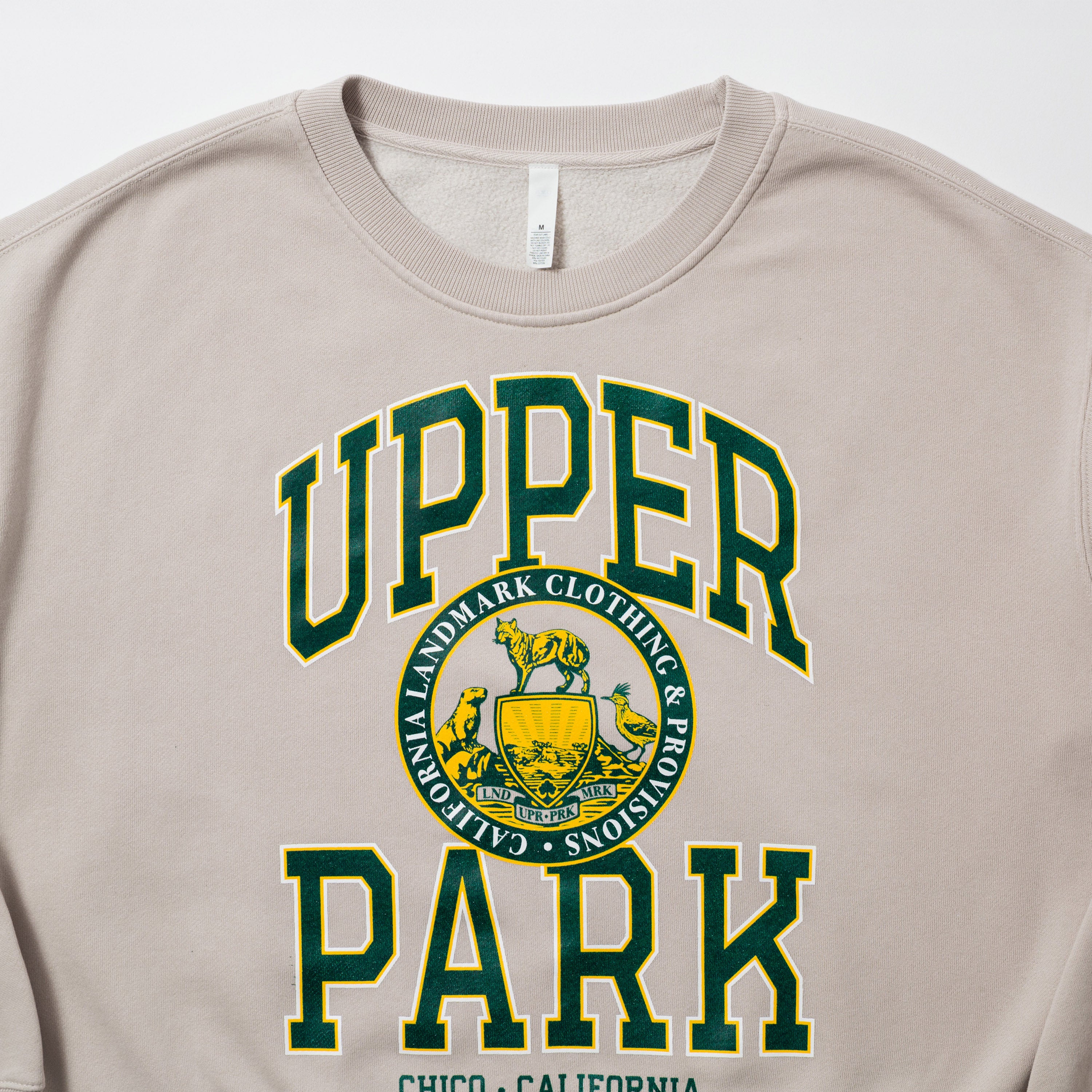 Women's Campus Crew Sweatshirt - Beige sweatshirt with 'Upper Park' text and logo on a white background