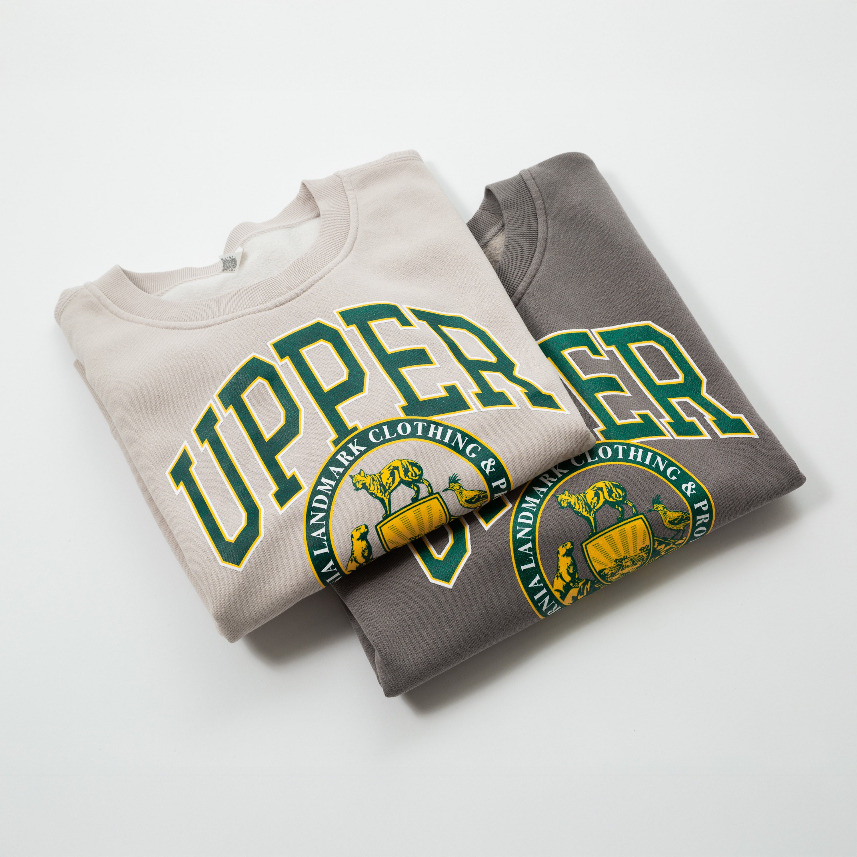 Women's Campus Crew Sweatshirt - Two folded sweatshirts with 'Upper' text and logo on a white background
