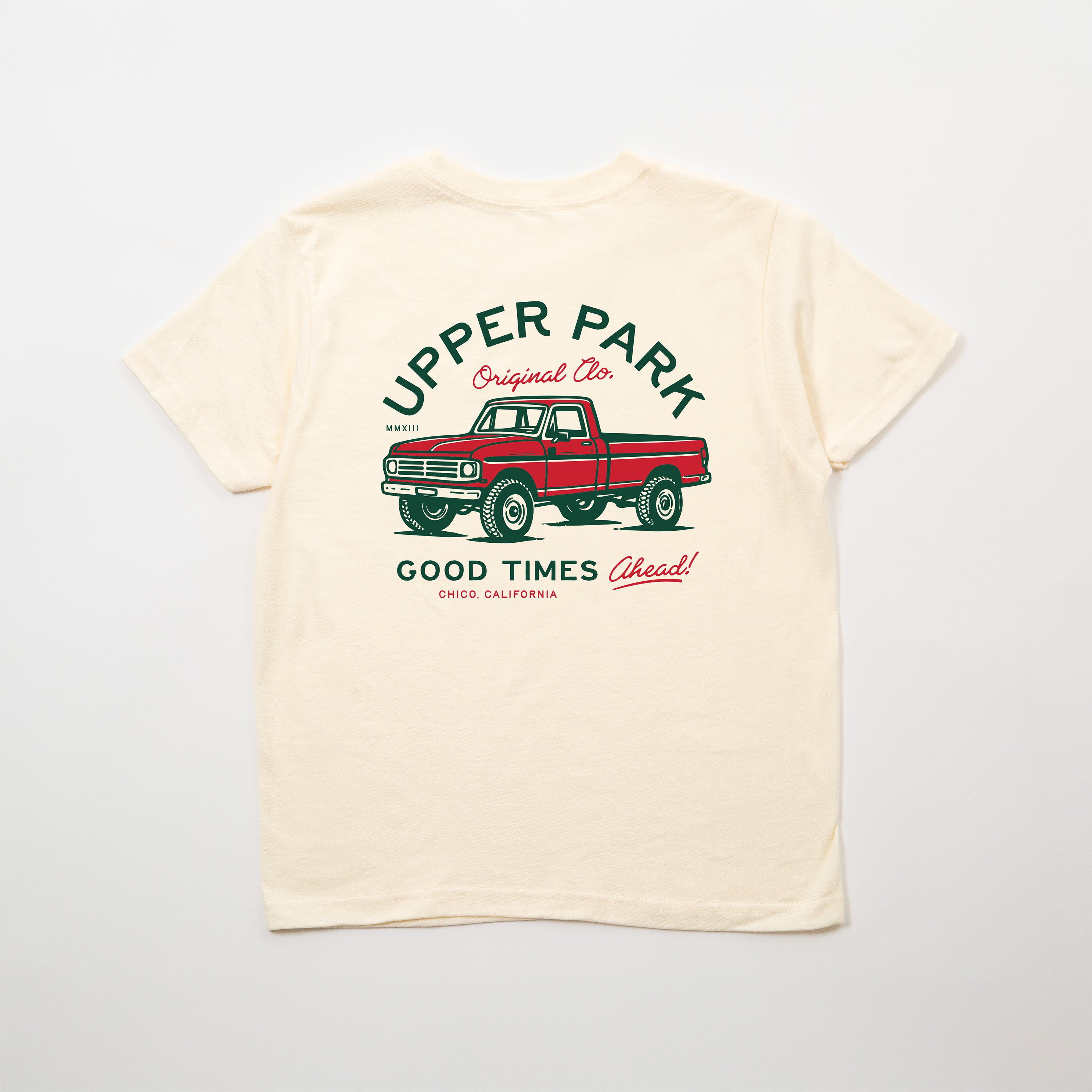 Beige t-shirt with red truck graphic and text on a white background - Upper Park Good Times Youth Tee
