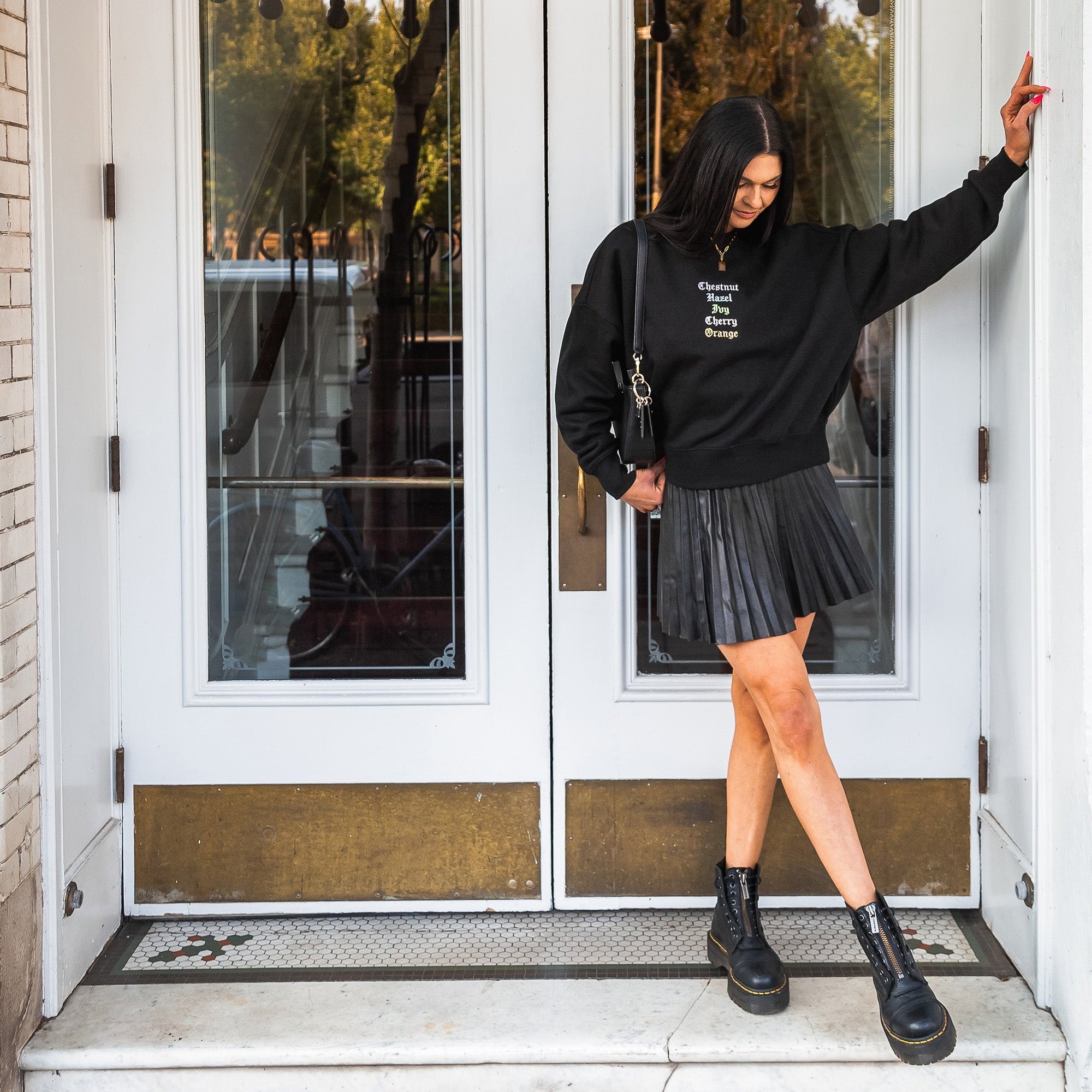 Woman in downtown Chico, Ca wearing an Embroidered Streets Women's Heavy Crew from Upper Park Clothing