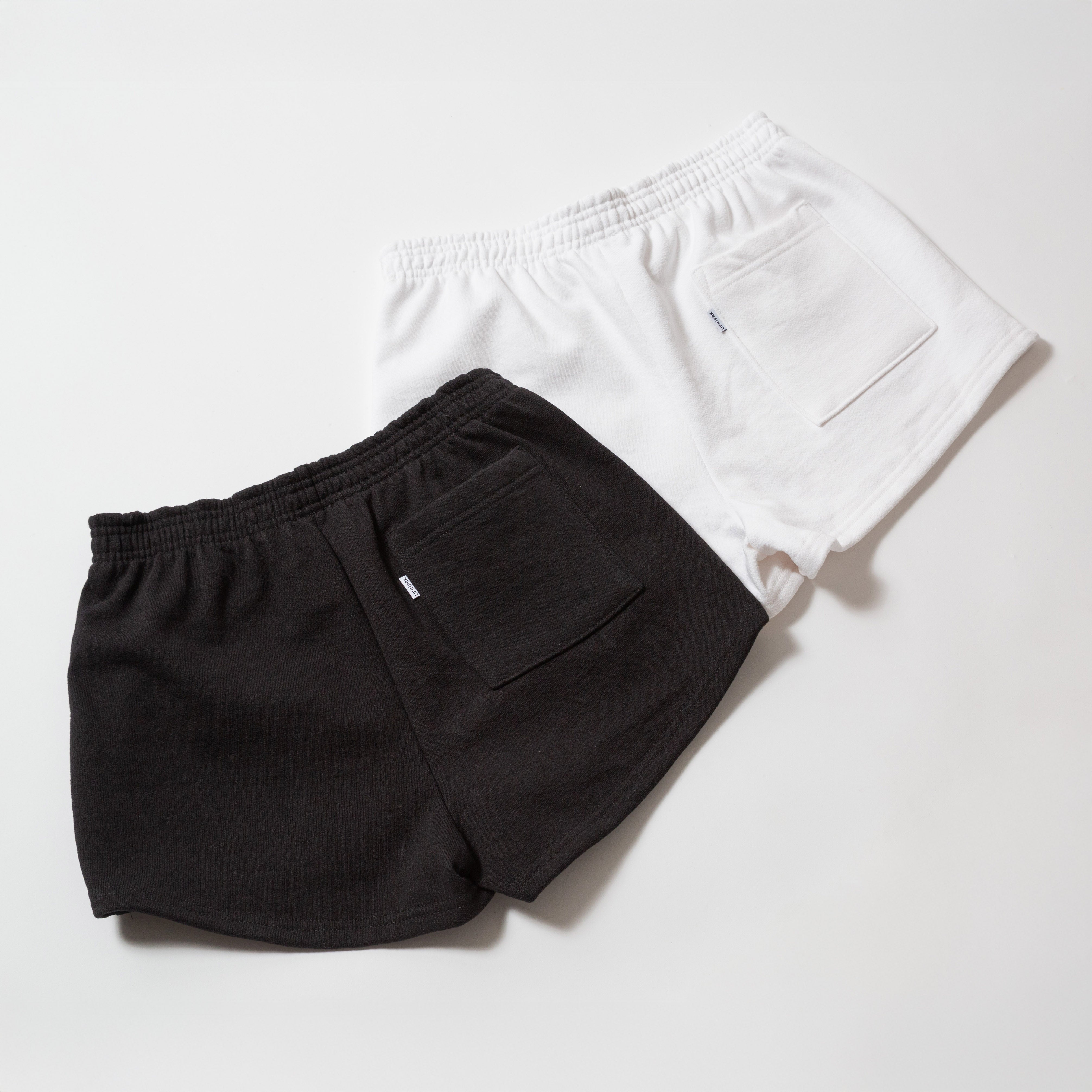 Basics Women's Heavy Fleece Cotton Shorts - Black and white shorts on a light gray background