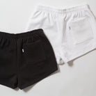 Basics Women's Heavy Fleece Cotton Shorts - Black and white shorts on a light gray background