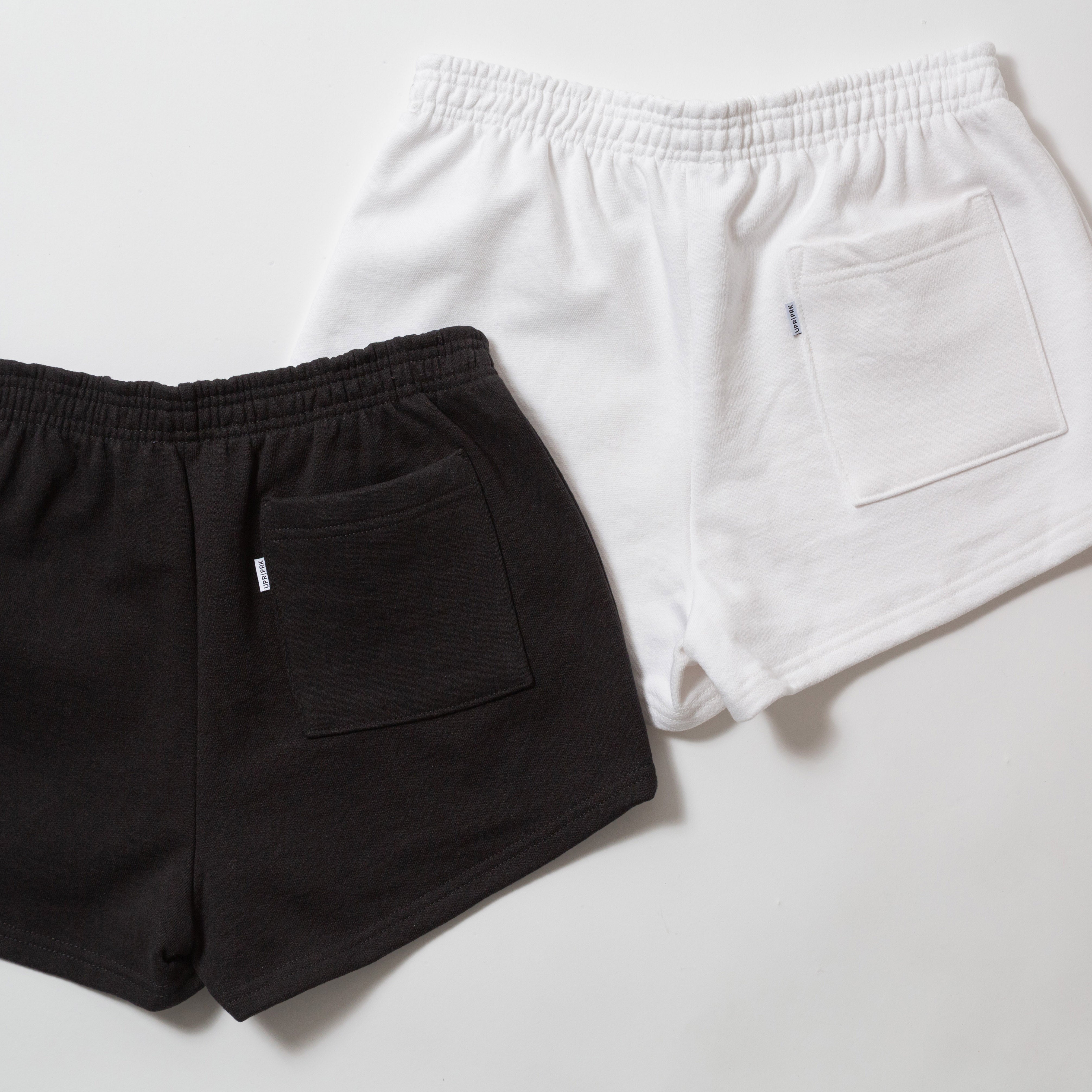 Basics Women's Heavy Fleece Cotton Shorts - Black and white shorts on a light gray background