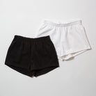Basics Women's Heavy Fleece Cotton Shorts - Black and white shorts on a light gray background