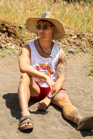 man sitting on the beach in Upper Bidwell Park wearing a Washout tank top from Upper Park Clothing
