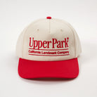 Cream and red cap with 'Upper Park' branding on a white background - California Landmark Company