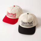 Two vintage style baseball caps with 'Upper Park' branding on a white background - California Landmark Company