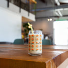 California Poppy Flower Beer Can Glass filled with iced coffee on a table in Daycamp Coffee - Upper Park Clothing - Chico, Ca