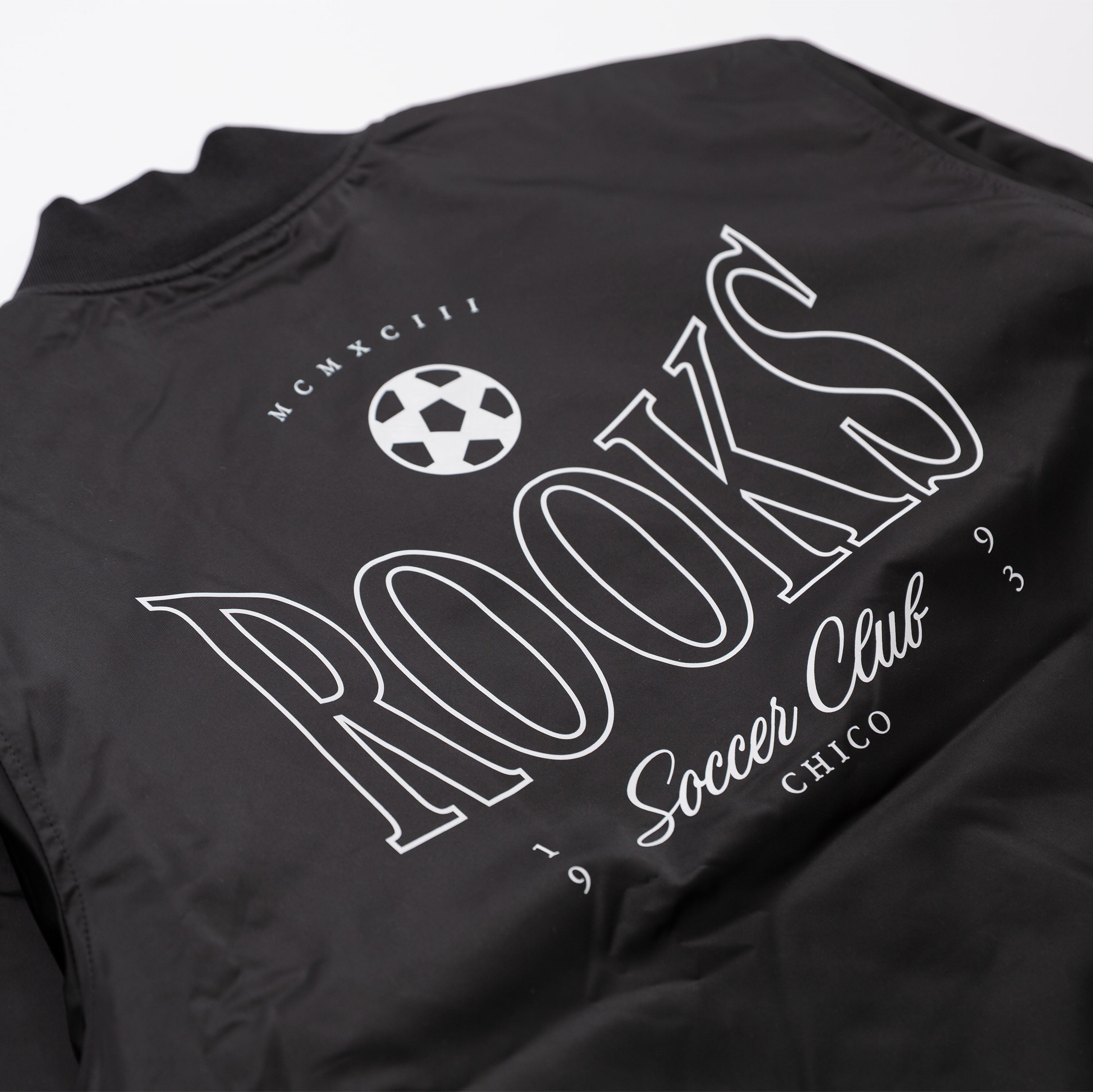 Chico Rooks Soccer Club x Upper Park Jacket - Black t-shirt with 'ROOKS Soccer Club Chico' printed in white on a plain background