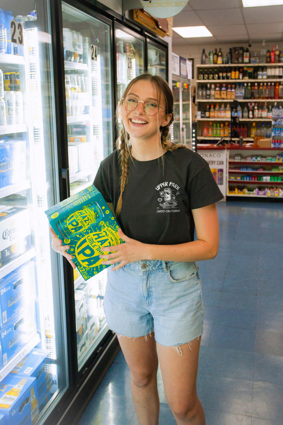 women standing in front of a gas station fridge wearing a Corner Store Connoisseur crop tee from Upper Park Clothing