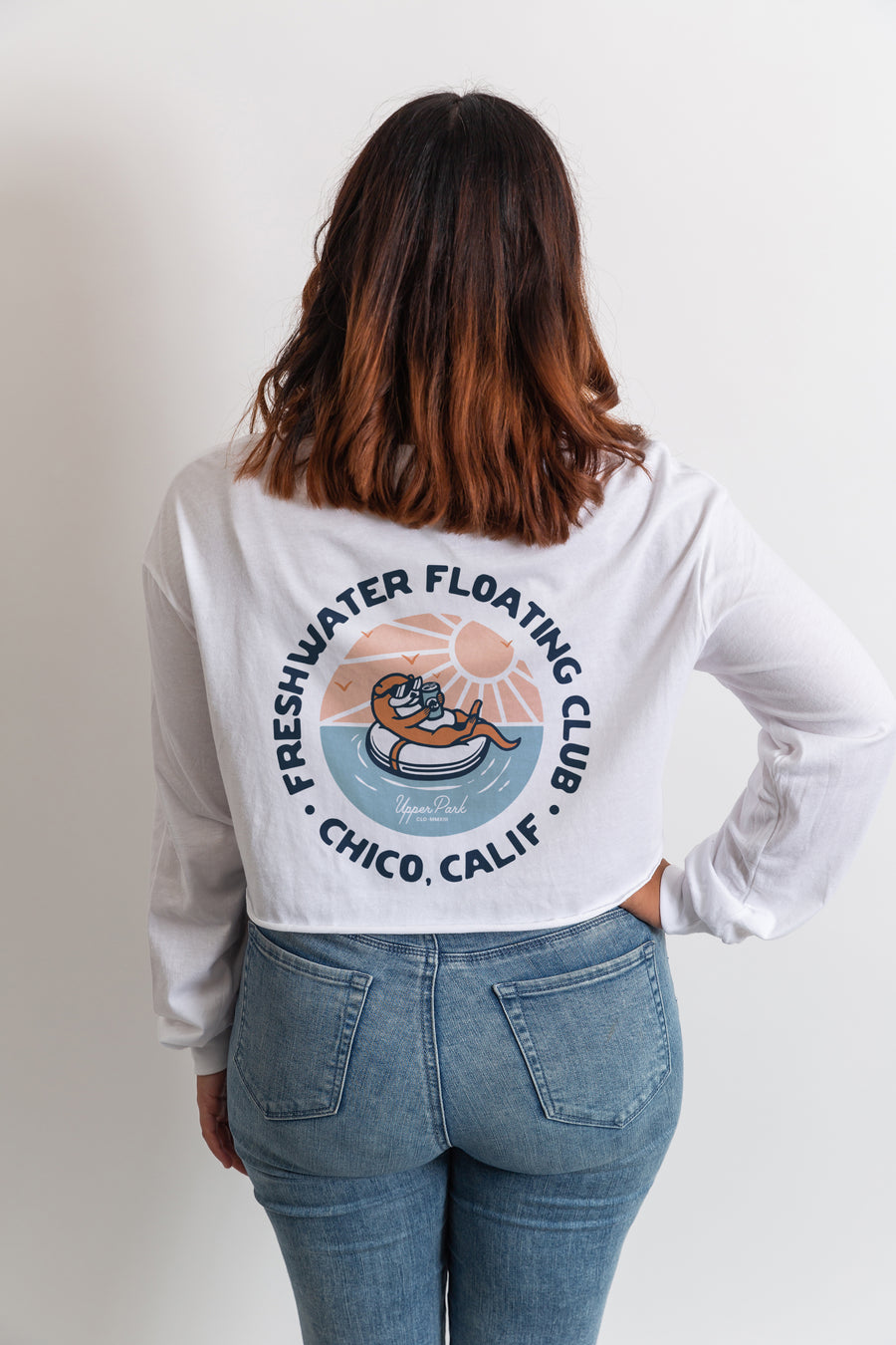 women standing in a photography studio wearing a Freshwater Floating Club cropped long sleeve shirt from Upper Park Clothing