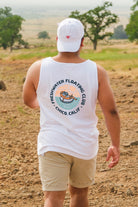 man walking in Upper Bidwell Park wearing a Freshwater Floating Club washed tank top from Upper Park Clothing