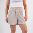 Beige shorts worn by a person on a plain background - Upper Park Basics - Garment Dyed Relax Shorts