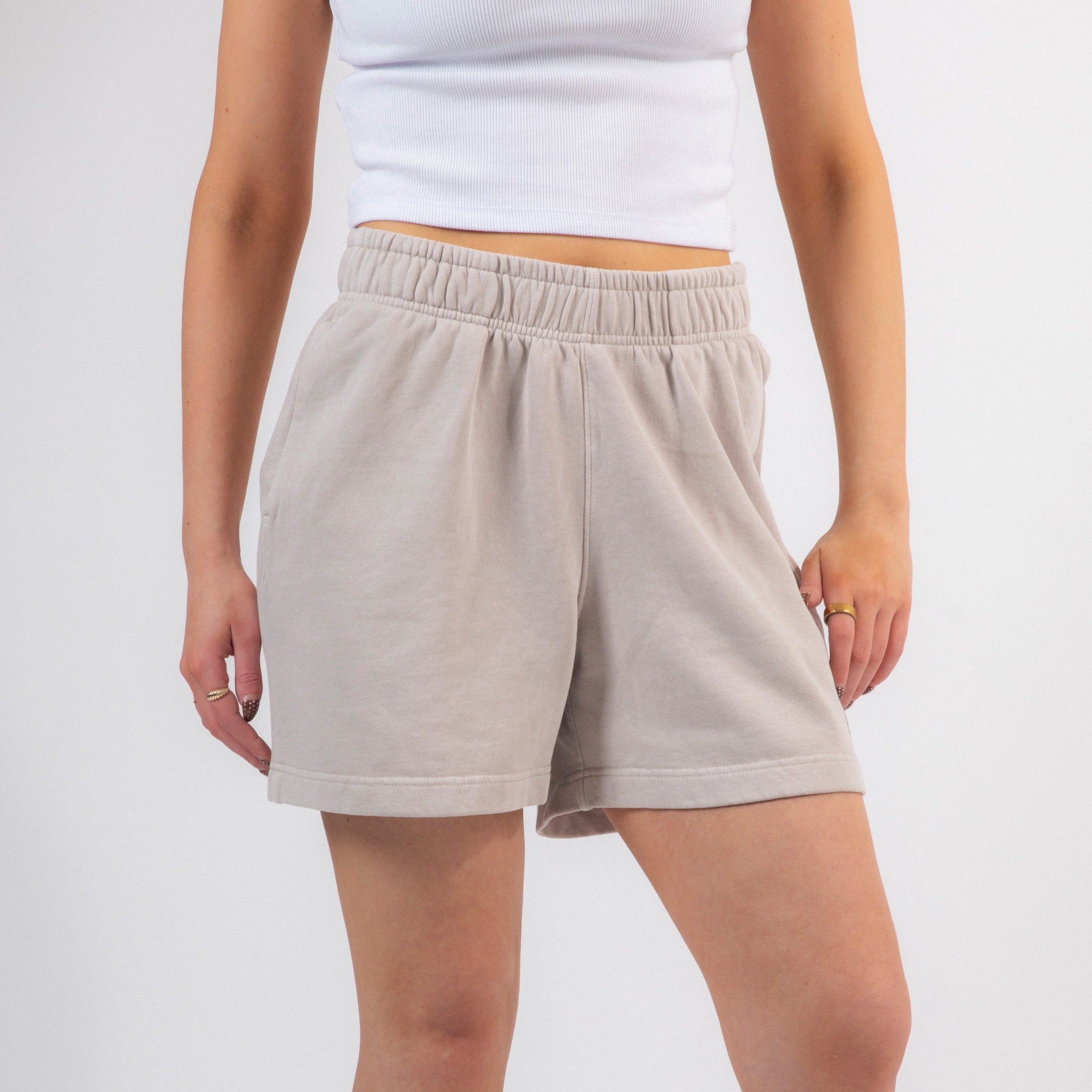 Beige shorts worn by a person on a plain background - Upper Park Basics - Garment Dyed Relax Shorts