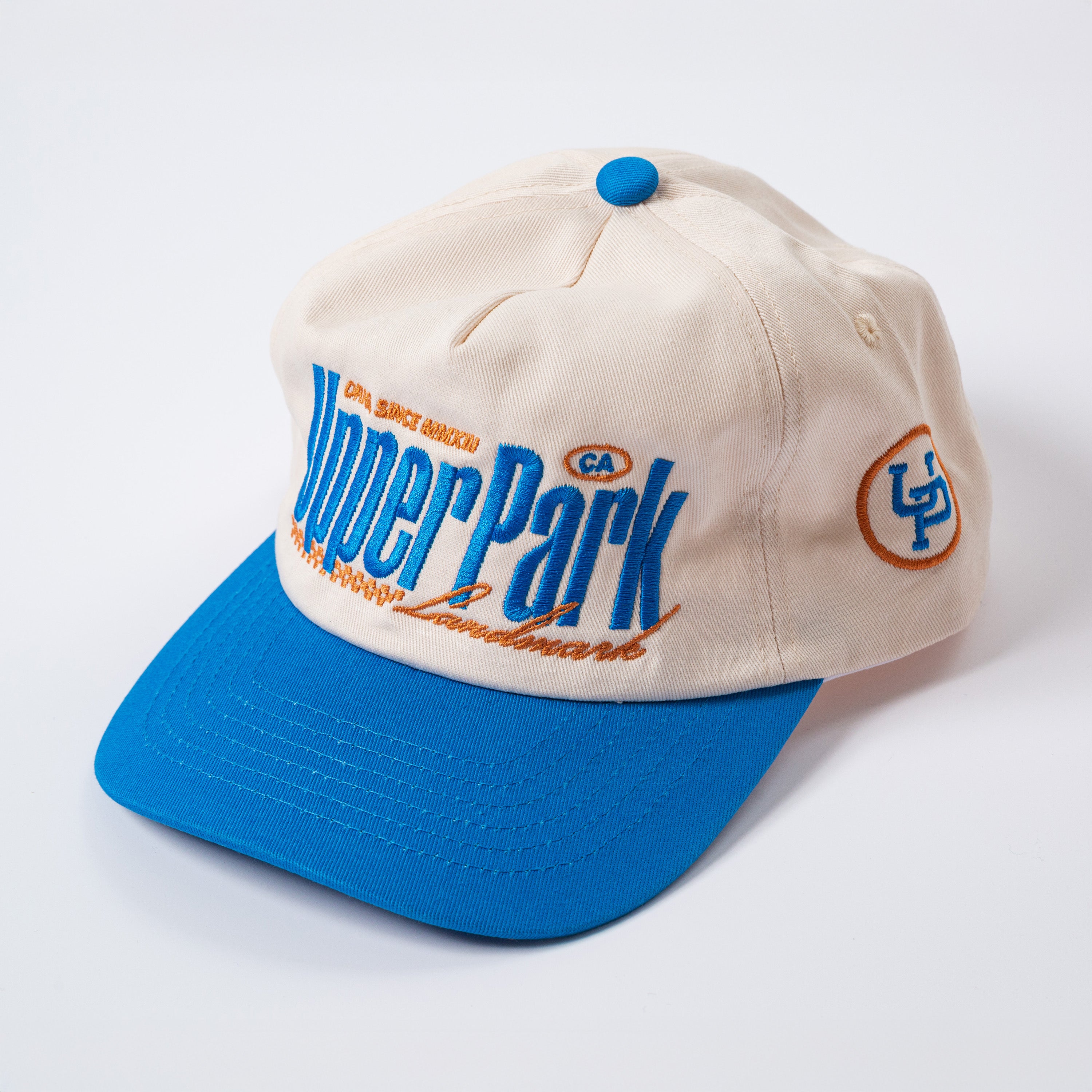 Beige and blue cap with 'Upper Park' branding on a white background - Rally Unstructured Vintage Style Hat
