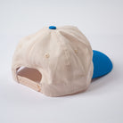 Beige and blue cap on a white background - backside snapback - Rally Unstructured Vintage Style Hat