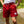 man standing in a creek in Upper Bidwell Park while wearing cardinal swim shorts from Upper Park Clothing