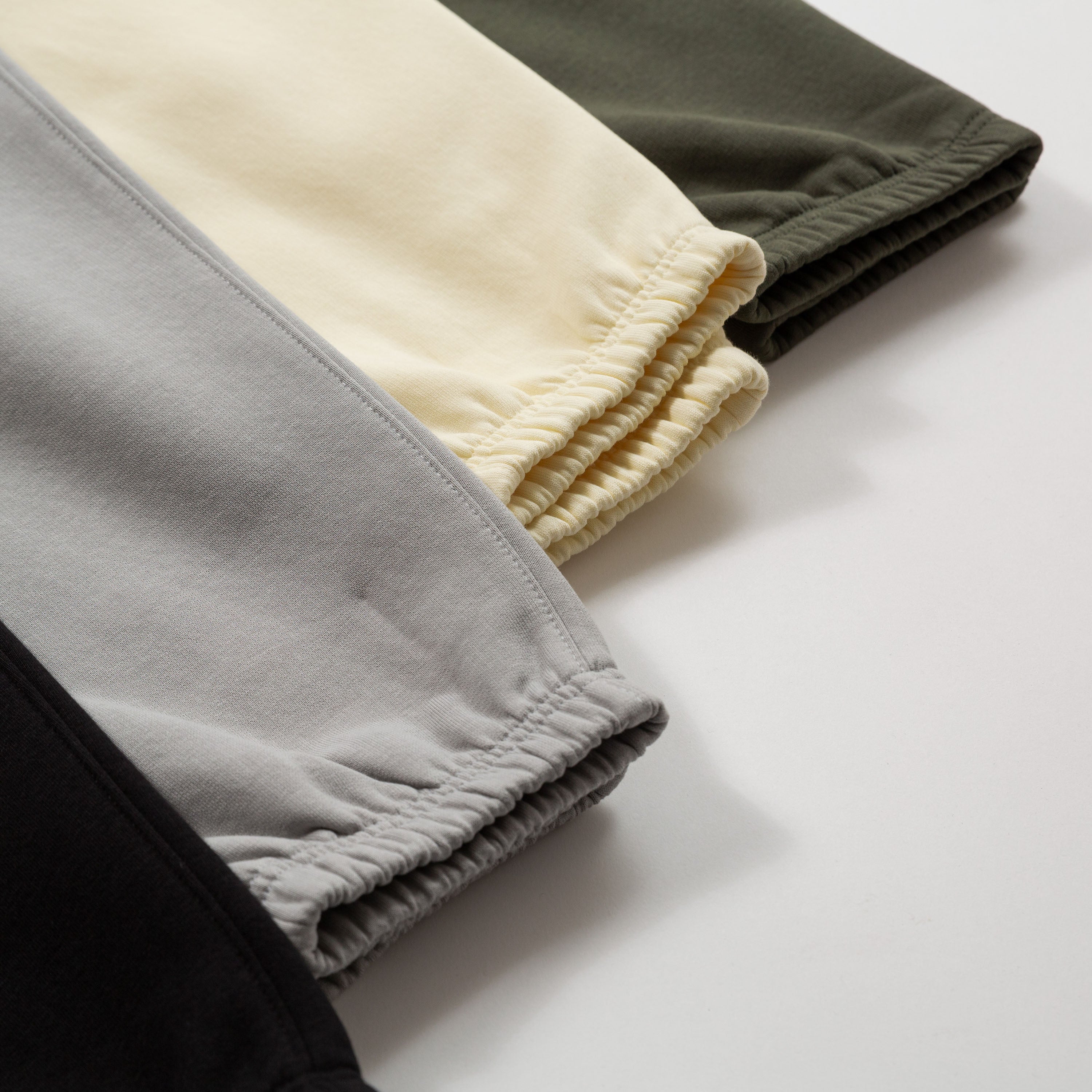 close up of sweatpants legs in various colors on a light surface - Upper Park Athletics Sweatpants Set