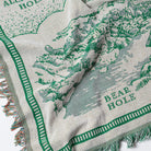 Textile with 'Bear Hole' branding and green and white pattern - Upper Bidwell Park Woven Blanket