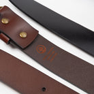 a close up of two leather belts showing the underside and top side textures with  an etching burned into the underside showing 100% leather - Upper Park basic leather belt