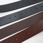 a close up of two leather belts showing the underside and top side textures with the loop holes - Upper Park Basic Leather Belt