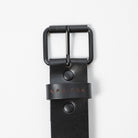 black leather belt with black metal belt buckle on a white background - UPR PRK etched into the leather - Upper Park Basic Leather Belt