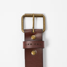 brown leather belt with brass metal belt buckle on a white background - UPR PRK etched into the leather - Upper Park Basic Leather Belt