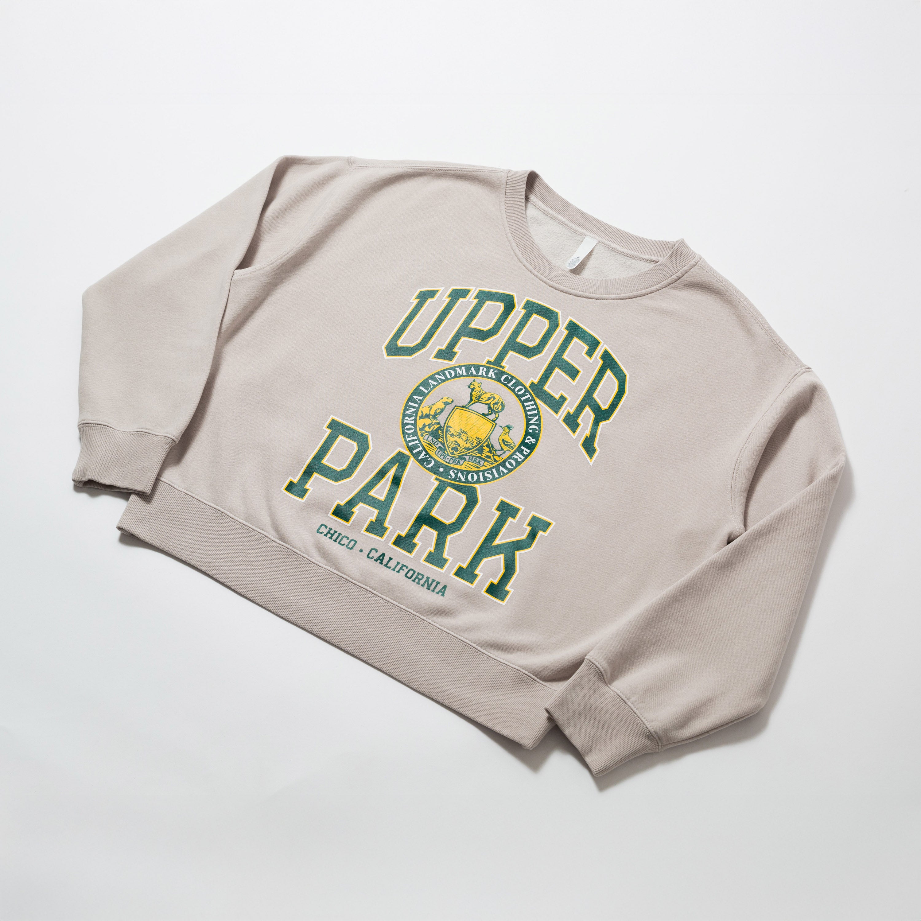 Women's Campus Crew Sweatshirt - Beige sweatshirt with 'Upper Park' text and logo on a white background