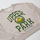 Women's Campus Crew Sweatshirt - Beige sweatshirt with 'Upper Park' text and logo on a white background