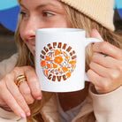 Woman holding California Poppy Love Mug from Upper Park Clothing - Chico, Ca